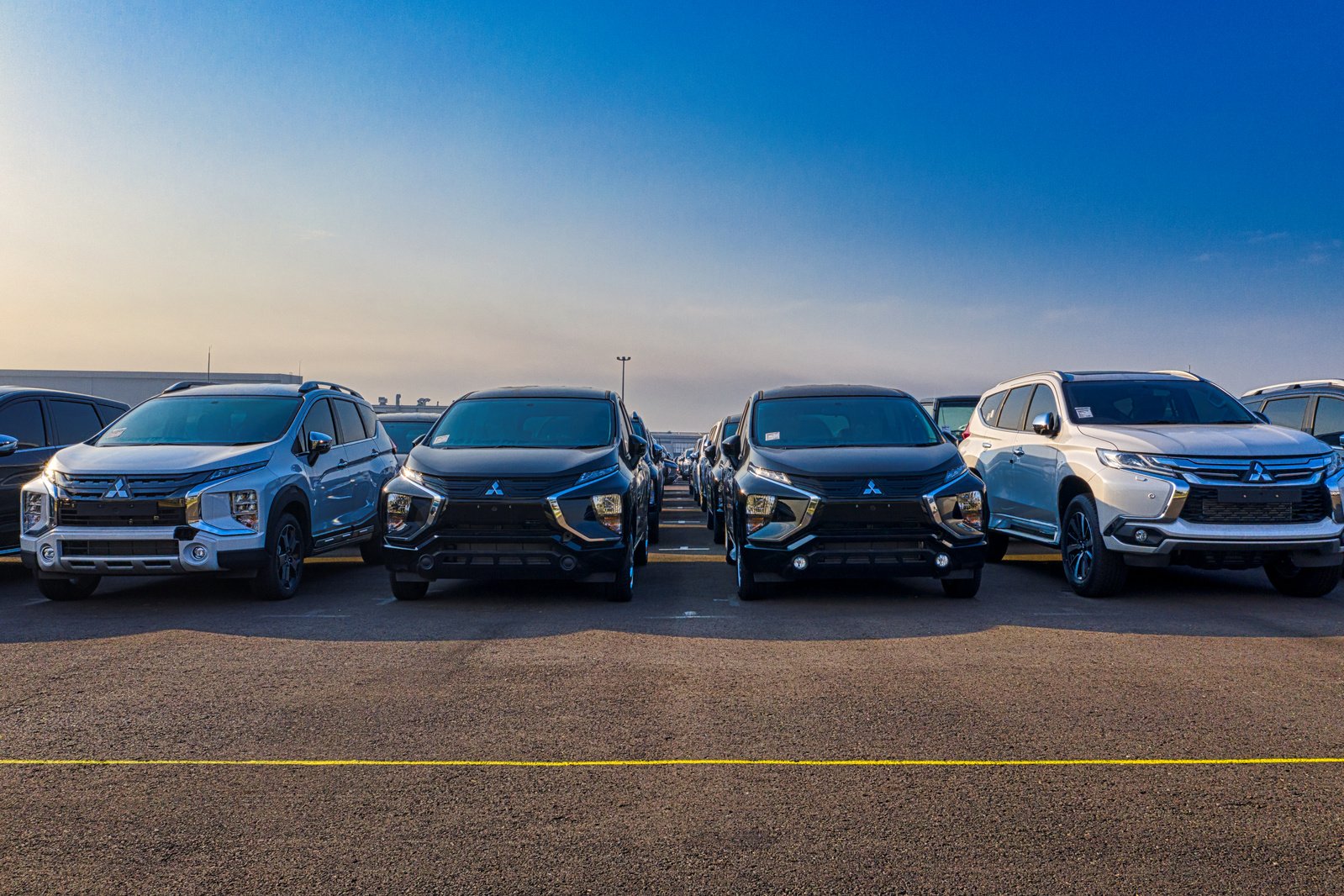 Modern SUV cars parked in row